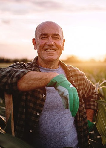 man smiling in field