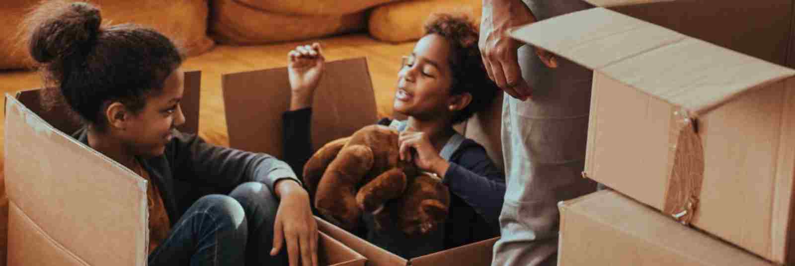 kids playing in moving boxes