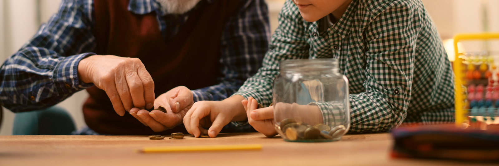 a grandfather and grandson counting money