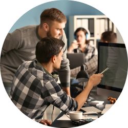 two men looking at computer