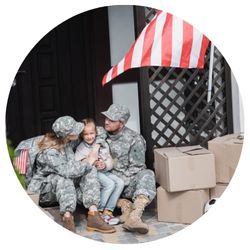 veteran married couple hugging their daughter