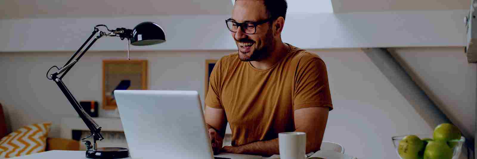 Man in office filing out paperwork