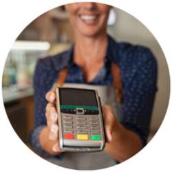 woman holding a credit card machine