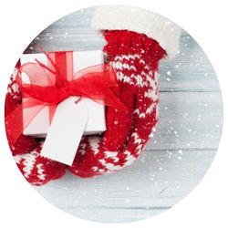 red mittens holding a gift