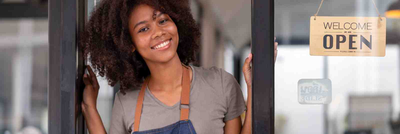 Business Woman using Credit card to Open a business