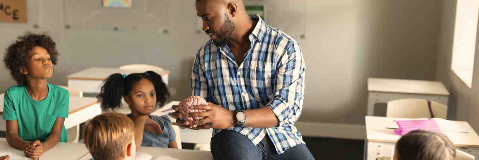 Teacher with students learning about the brain