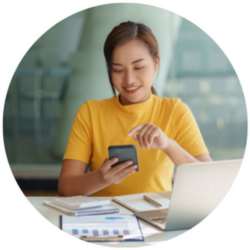 Woman looking at phone while working